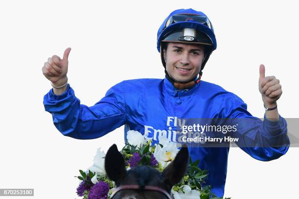 Jockey Mickael Barzalona celebrates after riding Talismanic to a win in the Longines Breeders' Cup Turf on day two of the 2017 Breeders' Cup World...