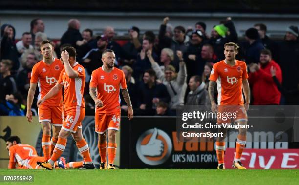 Blackpool players, from left, Kelvin Mellor, Will Aimson, Jimmy Ryan, Jay Spearing and Nick Anderton react after Boreham Wood's Blair Turgott scored...