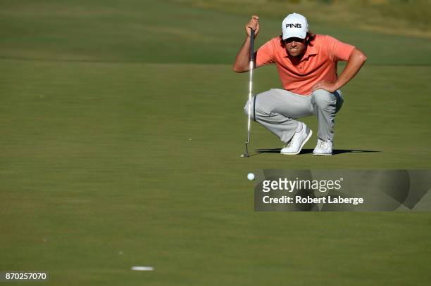 Aaron Baddeley of Australia lines up a putt on the 15th green during the third round of the Shriners Hospitals For Children Open at the TPC Summerlin...