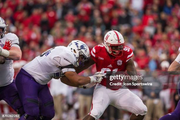 Nebraska Cornhusker defensive lineman Freedom Akinmoladun battles against Northwestern Wildcat offensive lineman Rashawn Slater during the second...