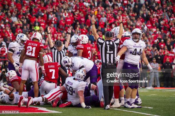 Northwestern Wildcat quarterback Clayton Thorson scores the winning touchdown with a one yard run in overtime against the Nebraska Cornhuskers...