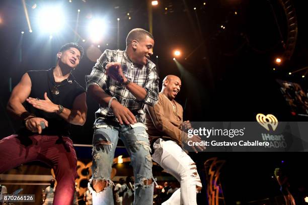 Chyno Miranda and Gente de Zona perform onstage during the iHeartRadio Fiesta Latina: Celebrating Our Heroes at American Airlines Arena on November...