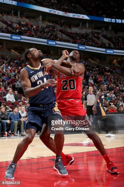Quincy Pondexter of the Chicago Bulls and Tony Allen of the New Orleans Pelicans box each other out during the game on November 4, 2017 at the United...
