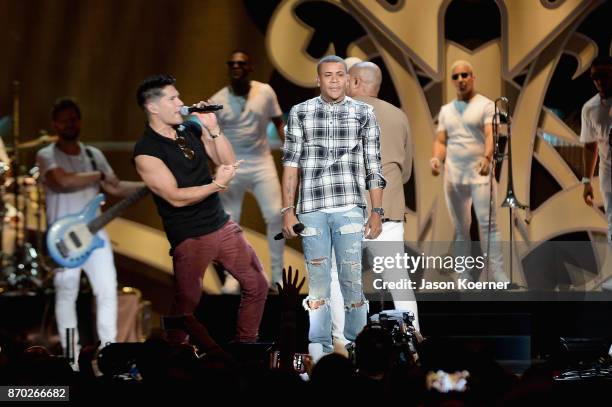 Chyno Miranda and Randy Malcom perform onstage during the iHeartRadio Fiesta Latina: Celebrating Our Heroes at American Airlines Arena on November 4,...