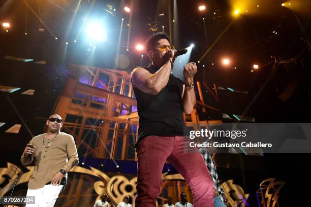 Alexander Delgado from Gente de Zona and Chyno Miranda perform onstage during the iHeartRadio Fiesta Latina: Celebrating Our Heroes at American...