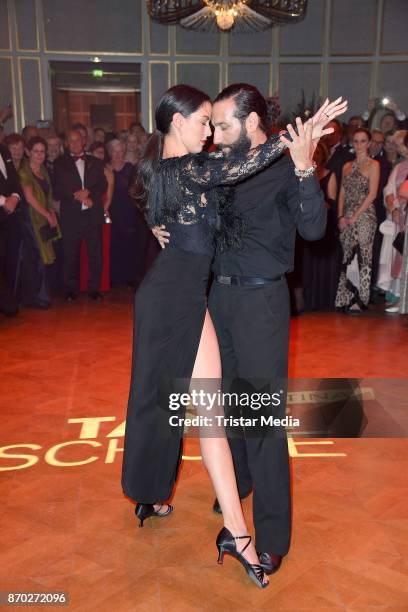 Rebecca Mir in a dress of Boss Couture) and her husband Massimo Sinato perform the Leipzig Opera Ball on November 4, 2017 in Leipzig, Germany.