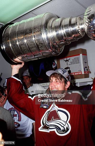 Peter Forsberg of the Colorado Avalanche celebrates winning the Stanley Cup after defeating the Florida Panthers.