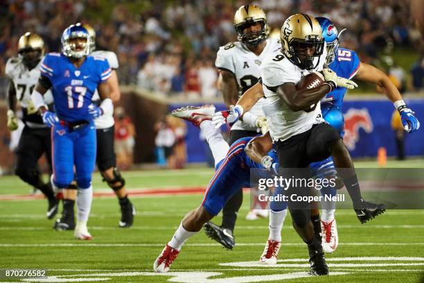 Adrian Killins Jr. #9 of the UCF Knights breaks free for a 34 yard touchdown run against the SMU Mustangs during the first half at Gerald J. Ford...