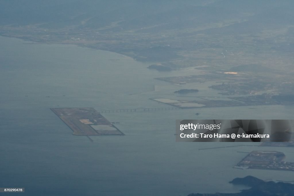 Kitakyushu airport in Fukuoka prefecture in Japan sunset time aerial view from airplane