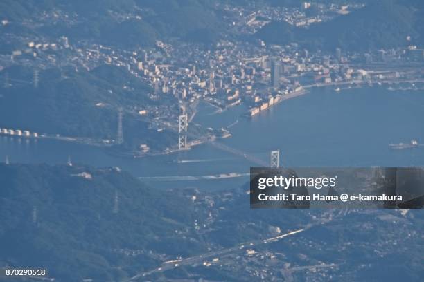 kannon straits between shimonoseki city in yamaguchi prefecture and kitakyushu city in fukuoka prefecture in japan sunset time aerial view from airplane - 北九州市 個照片及圖片檔