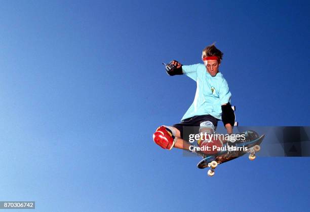 Tony Hawk 18 years old practices in his back yard on one of the ramps he built for his friends and himself. In 1986 he was making in excess of $...