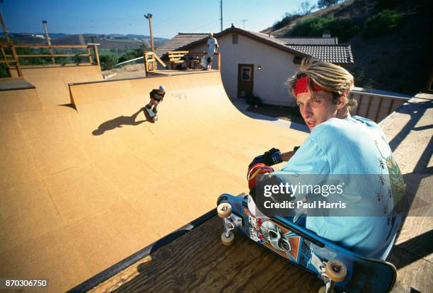 Tony Hawk 18 years old sits on one of his skateboard ramps in his back yard which he built for his friends and himself. In 1986 he was making in...