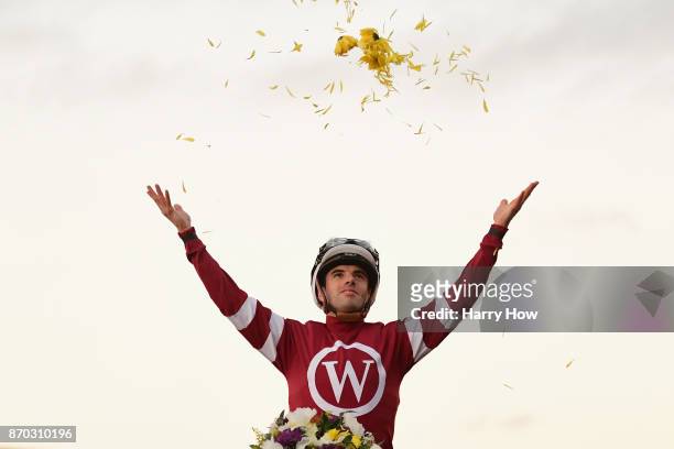 Jockey Florent Geroux celebrates after riding Gun Runner to a win in the Breeders' Cup Classic on day two of the 2017 Breeders' Cup World...