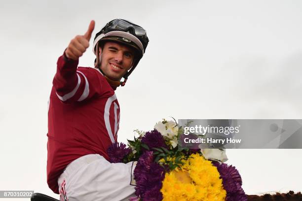 Jockey Florent Geroux celebrates after riding Gun Runner to a win in the Breeders' Cup Classic on day two of the 2017 Breeders' Cup World...