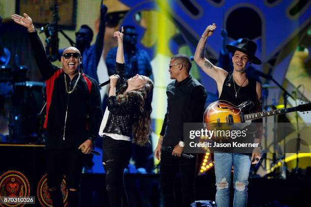 Alexander Delgado, Tirzah Joy Huerta, Randy Malcom and Jesse Eduardo Huerta perform onstage during the iHeartRadio Fiesta Latina: Celebrating Our...