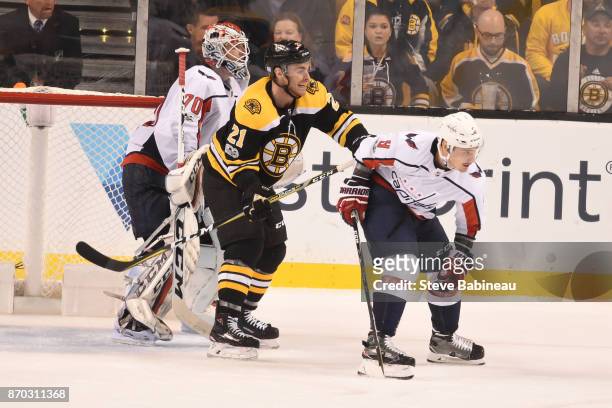 Jordan Szwarz of the Boston Bruins watches the play against Braden Holtby and Dmitry Orlov of the Washington Capitals at the TD Garden on November 4,...
