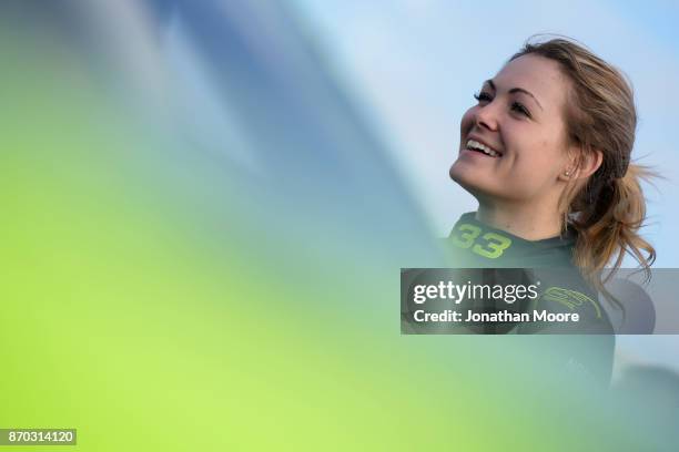 Nicole Behar, driver of the Custom Welding & Fabrication Toyota, stands next to her car during qualifying for the NASCAR K&N Pro Series West Coast...