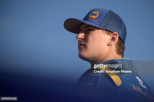 Todd Gilliland, driver of the NAPA Auto Parts Toyota, stands next to his car during qualifying for the NASCAR K&N Pro Series West Coast Stock Car...