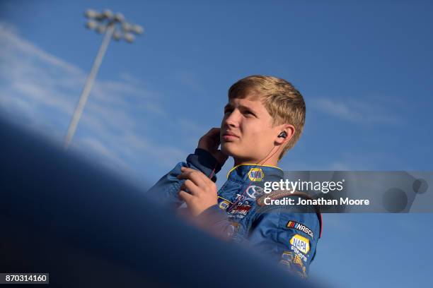 Derek Kraus, driver of the Carlyle Tools Toyota, stands next to his car during qualifying for the NASCAR K&N Pro Series West Coast Stock Car Hall of...