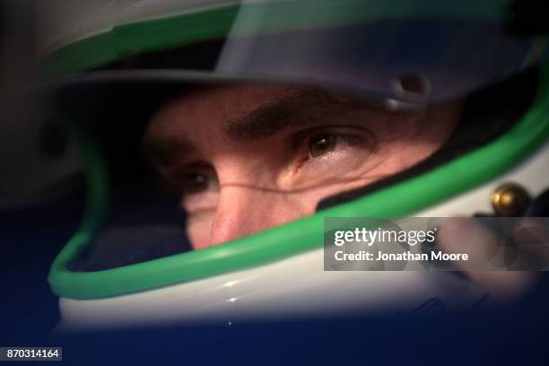 Michael Self, driver of the Sunrise Ford/Eibach Springs/Lucas Oil Ford, sits in his car during qualifying for the NASCAR K&N Pro Series West Coast...