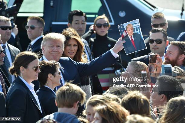 President Donald Trump and his wife Melania are welcomed upon arriving at Yokota Air Base in Tokyo on November 5, 2017. Trump touched down in Japan,...