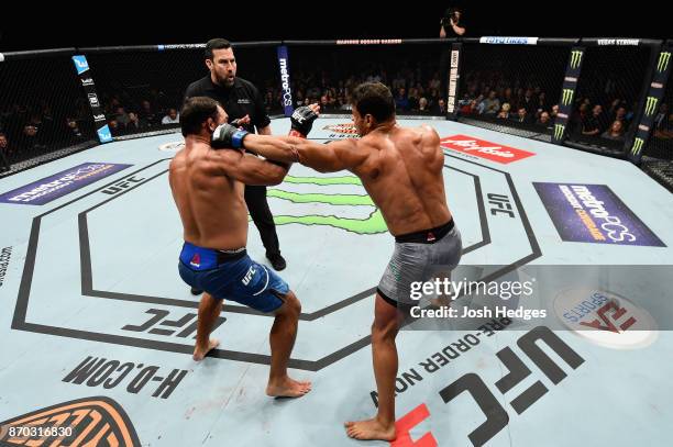 Paulo Costa of Brazil lands a punch against Johny Hendricks in their middleweight bout during the UFC 217 event at Madison Square Garden on November...