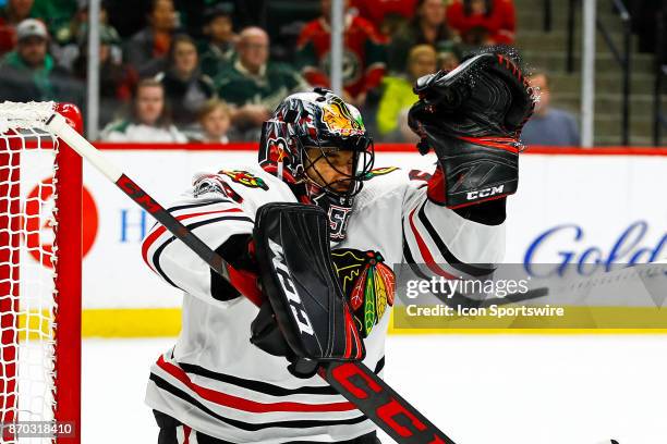 Chicago Blackhawks goalie Corey Crawford makes a save during the Central Division game between the Chicago Blackhawks and the Minnesota Wild on...