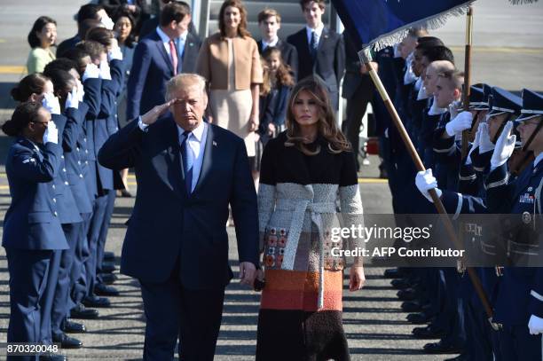 President Donald Trump and his wife Melania are welcomed upon arrival at Yokota Air Base in Fussa City, Tokyo prefecture on November 5, 2017. Trump...