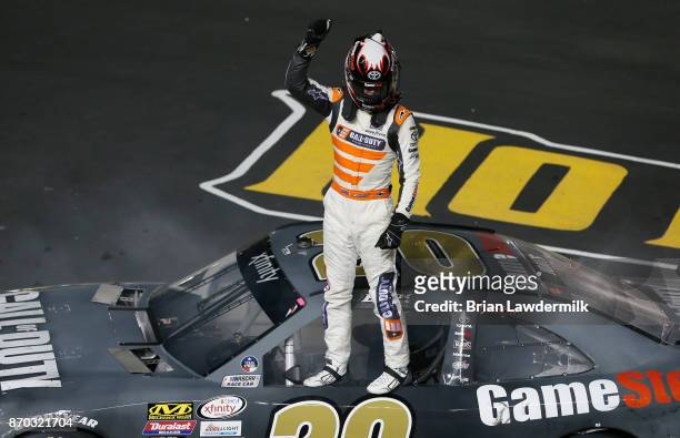 Erik Jones, driver of the GameStop/Call of Duty WWII Toyota, celebrates after winning the NASCAR XFINITY Series O'Reilly Auto Parts 300 at Texas...