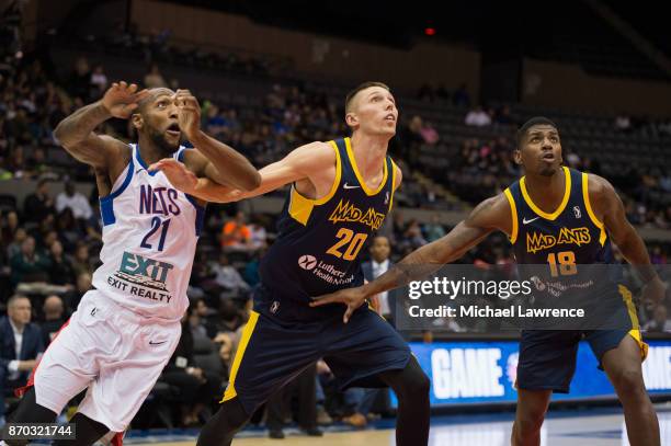 Kamari Murphy of the Long Island Nets, Jarrod Uthoff of the Fort Wayne Mad Ants, DeQuan Jones of the Fort Wayne Mad Ants during an NBA G-League game...