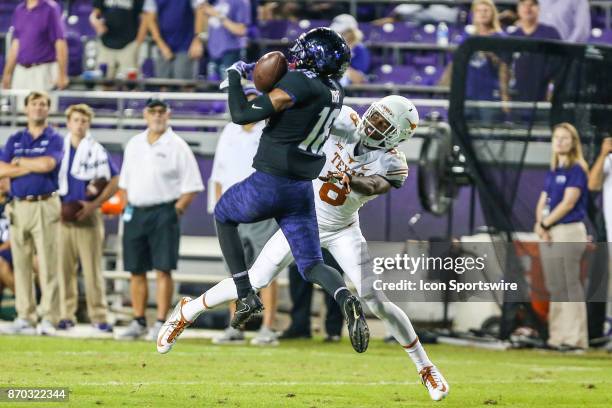 Horned Frogs safety Kerry Johnson and Texas Longhorns wide receiver Dorian Leonard battle for the football during the game between the TCU Horned...