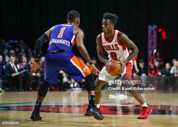 Antonio Blakeney of the Windy City Bulls is defended by Xavier Rathan-Mayes of the Westchester Knicks during the second half of an NBA G-League game...