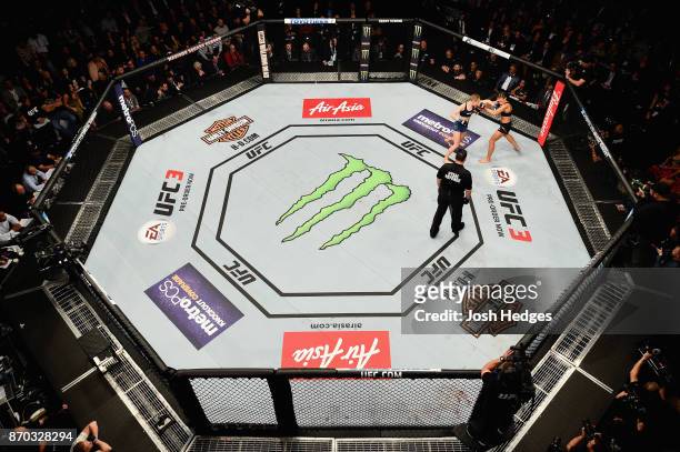 Rose Namajunas fights Joanna Jedrzejczyk of Poland in their UFC women's strawweight championship bout during the UFC 217 event at Madison Square...