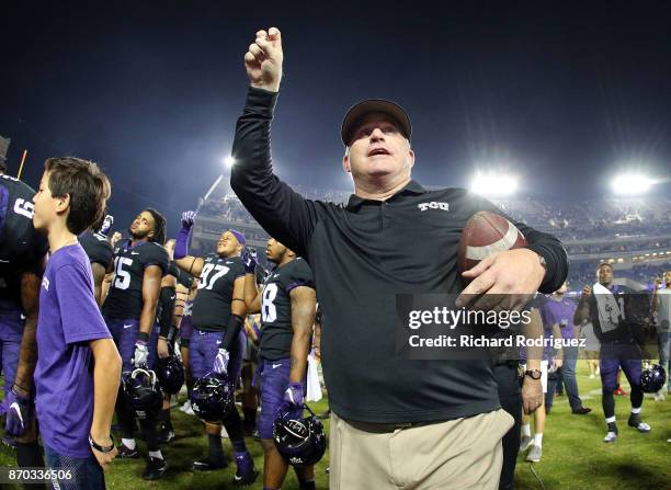 Head coach Gary Patterson of the TCU Horned Frogs holds his arm up as the band plays the alma mater after the 24-7 win over the Texas Longhorns at...