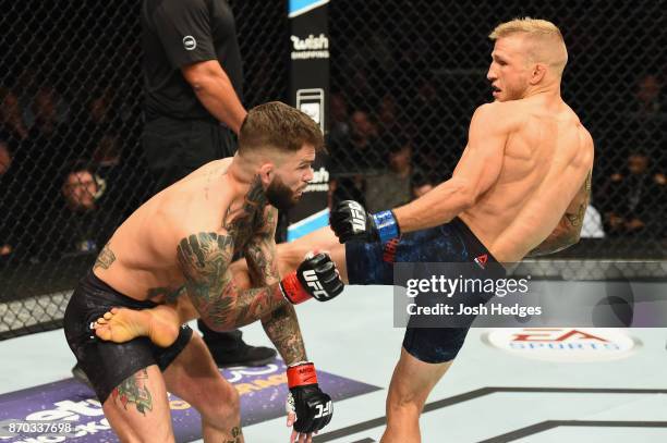 Dillashaw lands a kick against Cody Garbrandt in their UFC bantamweight championship bout during the UFC 217 event at Madison Square Garden on...