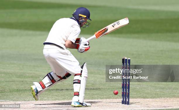 Glenn Maxwell of Victoria watches as the ball hits the stumps and he is dismissed during day two of the Sheffield Shield match between Victoria and...