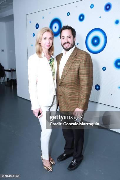 Alina Okshteyn and Ricardo Fernandez during the Ricardo Chavarria by Art Gallery NYC and Overseas Premier Entertainment Corp. On November 4, 2017 in...