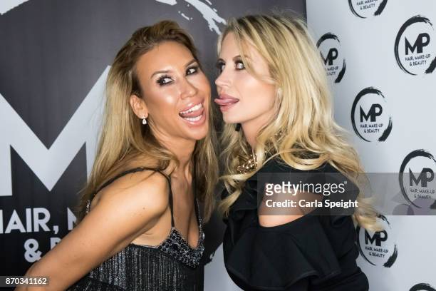 Ampika Pickson and Ester Dee attend the MP Hair & Make-Up 1st Birthday Celebration on November 3, 2017 in Widnes, England.