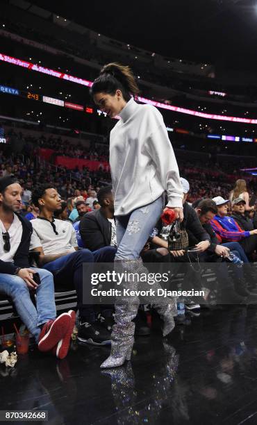 Kendall Jenner wearing a pair of $10,000 Saint Laurent boots attends the LA Clippers and Memphis Grizzlies basketball game at Staples Center November...