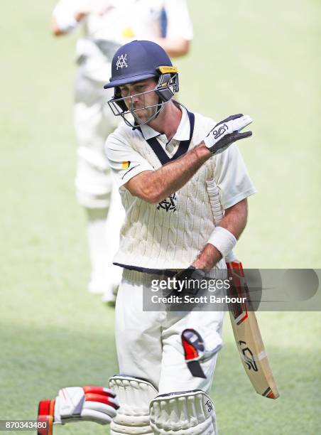 Glenn Maxwell of Victoria throws his gloves as he reacts after being dismissed during day two of the Sheffield Shield match between Victoria and...