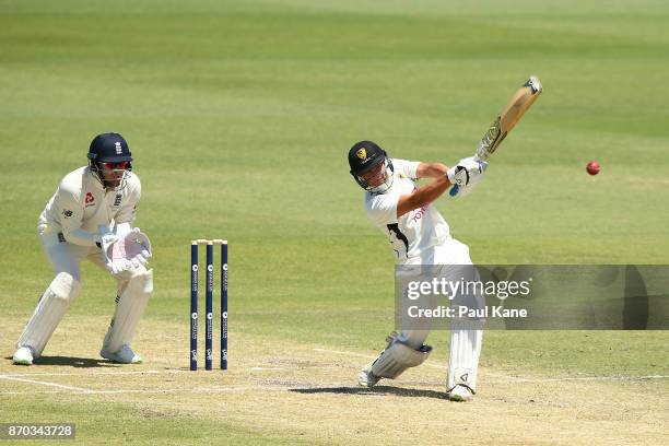 Josh Philippe of the WA XI hits Mason Crane of England to the boundary during day two of the Ashes series Tour Match between Western Australia XI and...