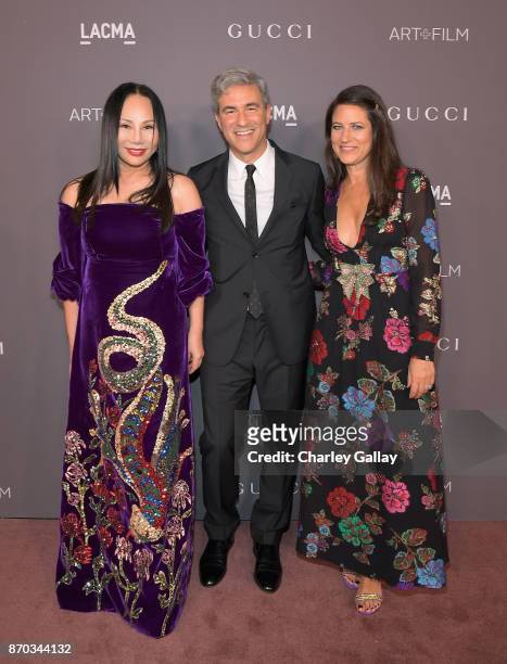 Art+Film Gala Co-Chair Eva Chow, LACMA CEO and Wallis Annenberg Director Michael Govan and Katherine Ross, all wearing Gucci, attend the 2017 LACMA...