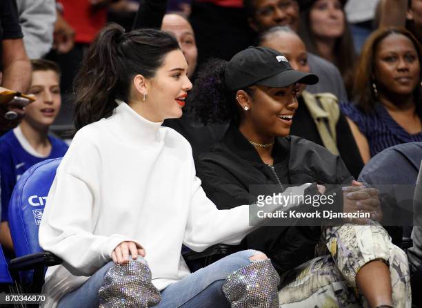 Kendall Jenner wearing a pair of $10,000 Saint Laurent boots attends the LA Clippers and Memphis Grizzlies basketball game at Staples Center November...