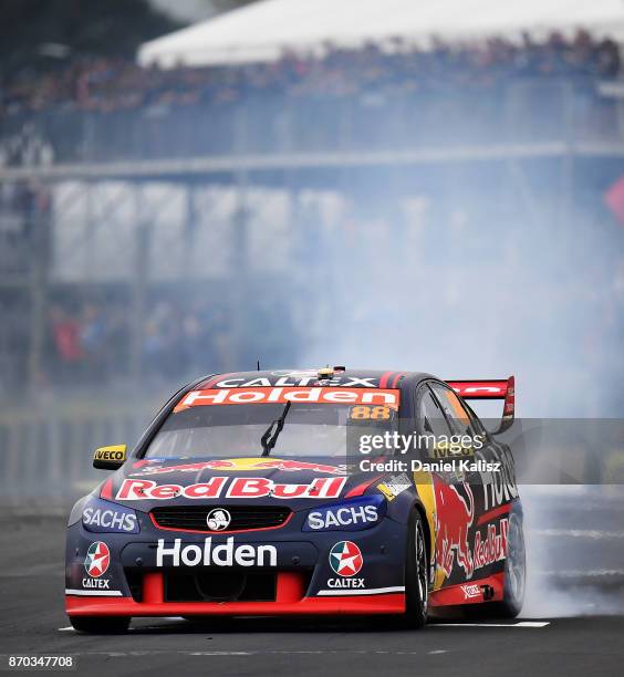 Jamie Whincup drives the Red Bull Holden Racing Team Holden Commodore VF celebrates after winning race 24 for the Auckland SuperSprint, which is part...