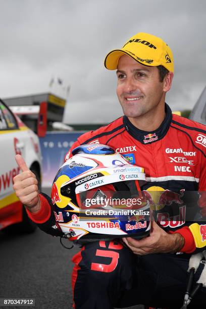 Jamie Whincup driver of the Red Bull Holden Racing Team Holden Commodore VF celebrates after winning reactsace 24 for the Auckland SuperSprint, which...