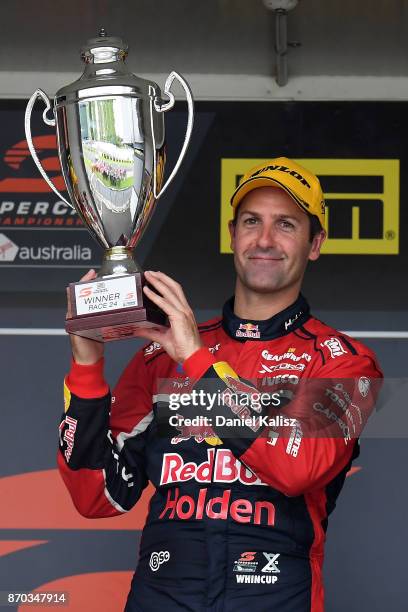 Jamie Whincup driver of the Red Bull Holden Racing Team Holden Commodore VF celebrates after winning reactsace 24 for the Auckland SuperSprint, which...