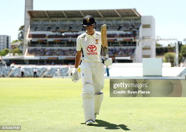 Josh Philippe of Western Australia XI walks from the ground after being dismissed by Mason Crane of England for 88 runs during day two of the Ashes...