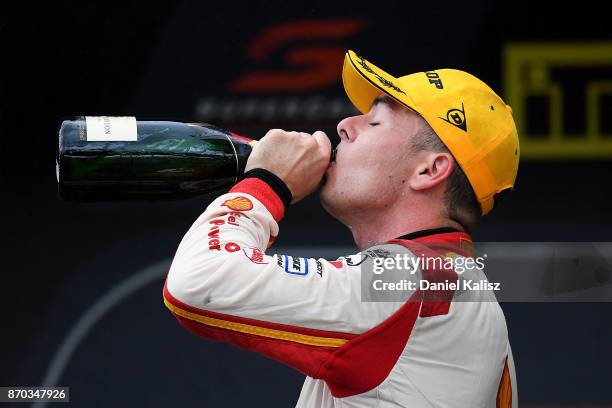 2nd place Scott McLaughlin driver of the Shell V-Power Racing Team Ford Falcon FGX celebrates on the podium after race 24 for the Auckland...