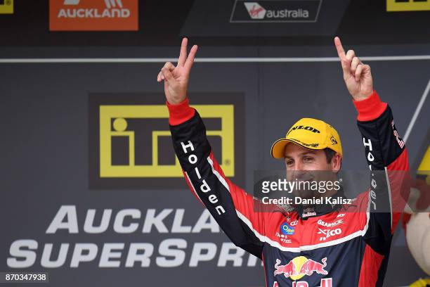 Jamie Whincup driver of the Red Bull Holden Racing Team Holden Commodore VF celebrates after winning reactsace 24 for the Auckland SuperSprint, which...