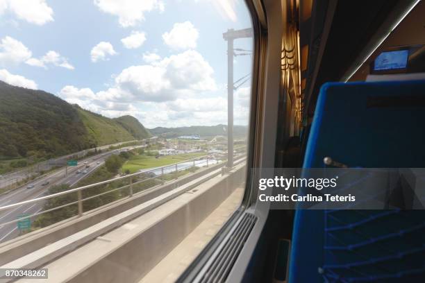 inside korean bullet train with view out of window - window seat stockfoto's en -beelden